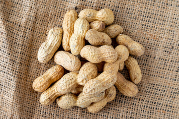 shelled peanuts on fabric. healthy organic peanuts
