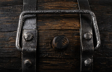 an element of an old wine barrel with hoops and a handle.