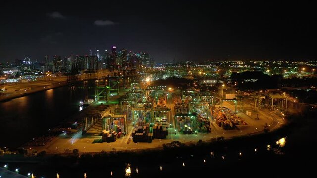 night time illumination singapore city cargo port bay downtown aerial panorama 4k 