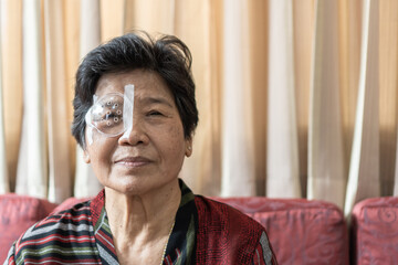 Cataract elderly patient, Asian old senior woman having eye care treatment on Age-related eye...