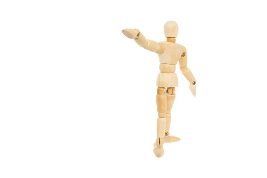 Wooden humanoid puppets perform gestures to express meaning such as pointing a hand forward Leadership or showing commitment to achieving goals isolated on white background