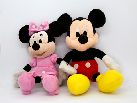 Mickey and Minnie Mouse plush doll. Toy. Cartoon characters from Walt Disney Pictures Studios. Minnie is Mickey Mouse's girlfriend. Soft toys for children.