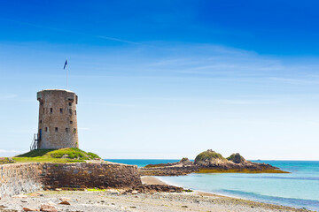 Le Hocq Tower and Common on the south shore of Jersey, Channel Islands, Britain, on a sunny summer...