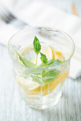 Closeup view of Limeade in a glass. Bright wooden background. 