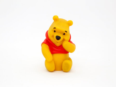 Winnie the Pooh. Teddy bear belonging to Christopher Robin. Honey loving yellow bear. Walt Disney character from books, movies and television series. Toy for young children. Plastic doll. 
