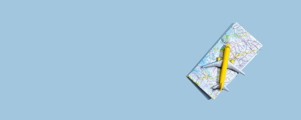 Travel theme with a miniature airplane and a map