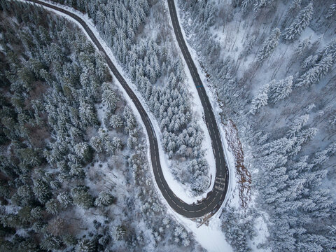 winding road aerial with snow in La panche des belles filles Vosges region France