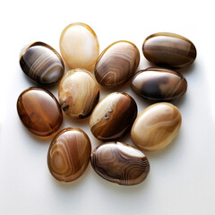 shiny moss agate gemstones on white background.