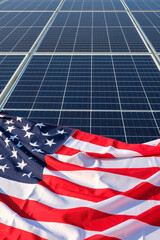 American flag close up on solar panels on solar power plant