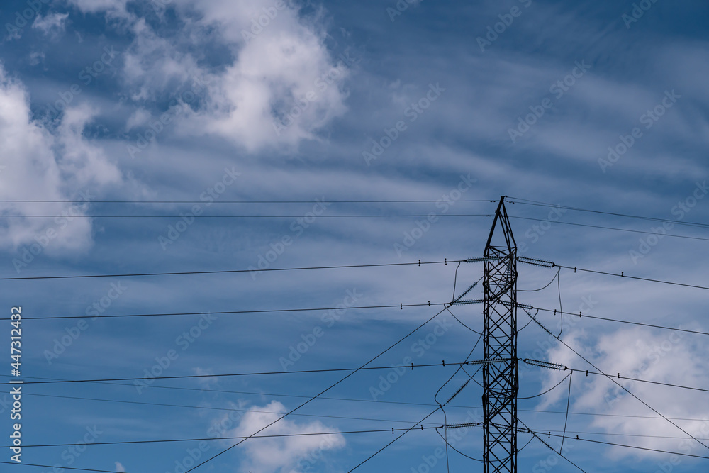 Wall mural high voltage electric tower transmitter. industrial transmission power line with blue sky and clouds