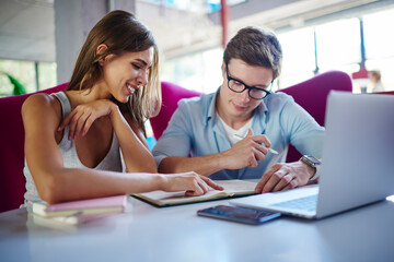 Young male and female student studying togetherness discussing education information at table desktop with laptop computer, skilled IT professionals with digital netbook and textbook e learning