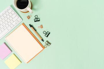 Creative flat lay photo of workspace desk. Top view office desk with keyboard and open mockup black...