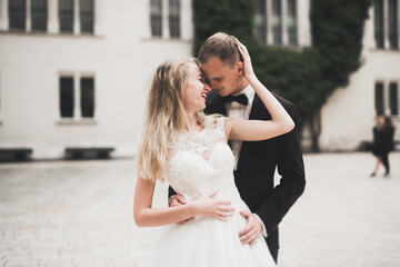 Naklejka premium Sensual portrait of a young wedding couple. Outdoor