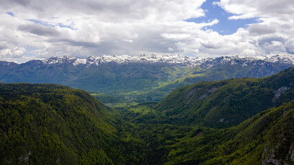 Voye valley in slovenia near lake bohinj with beautiful green forests.