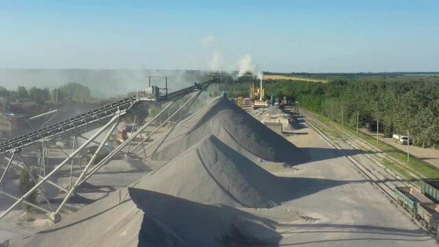Conveyor belts and machinery at a gravel pit. Quarry for the extraction of granite. Granite quarry. Extraction of granite. Open cast mine. Mining industry. Stone Quarrying - Aerial view