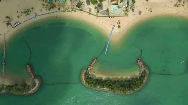 day time singapore cityscape famous sentosa island beach aerial topdown panorama 4k