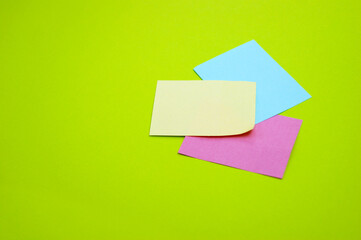 Blank colorful stickers on a light green background.