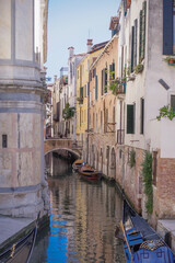 romantic idyllic views of the narrow canal street and renaissance facades of the city of Venice