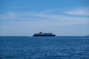 Ferryboat in blue Aegean sea and sky background. Greek island. Greece