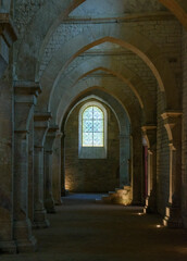arches of a church and stained window