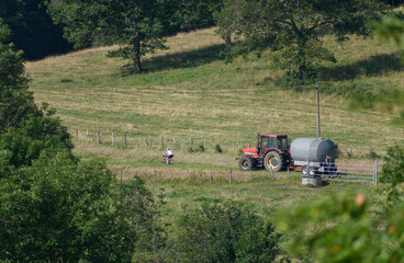 Tractor and cyclist in French countryside