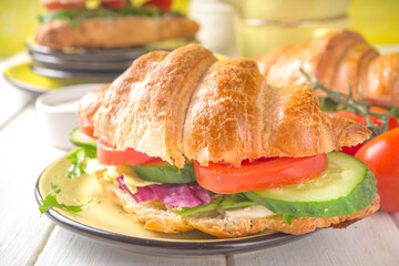 Croissant sandwich with fresh vegetables