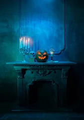 Keuken spatwand met foto Scary laughing pumpkin and old skull on ancient gothic fireplace. Halloween, witchcraft and magic. © Acronym