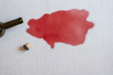 Dirty stain of spilled red wine on the carpet. top view