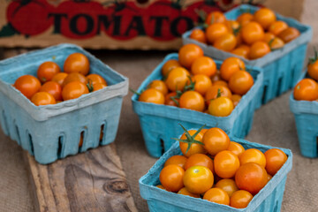 Cherry tomatoes for sale at a farmers' market. 
