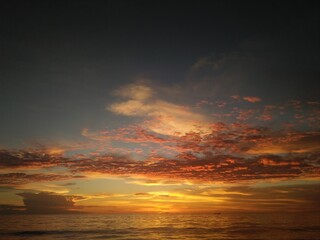 Sunset. Dramatic sunset sky with clouds. Dramatic sunset over the sea