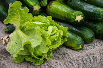 Lettuce and zucchini for sale at a farmers' market.