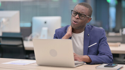 Young African Businessman with Laptop having Neck Pain