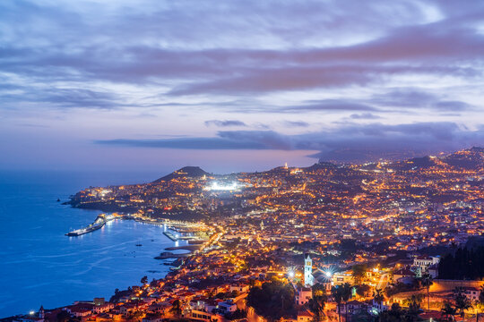 Dusk over the iIluminated city of Funchal viewed from Sao Goncalo, Madeira island, Portugal, Atlantic