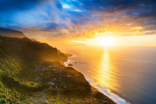 Clouds over Arco de Sao Jorge and Ponta Delgada lit by the warm sunset, Atlantic Ocean, Madeira island, Portugal
