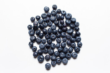 Top view picture of blueberries on the white table.
