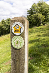A public footpath (the Gustav Holst Way, the Wardens Way and the Diamond Way) in the valley of the River Windrush near the Cotswold village of Naunton, Gloucestershire UK
