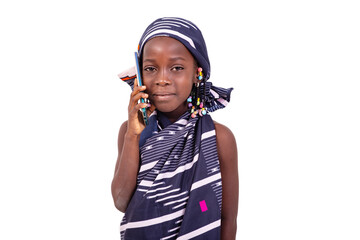 cute little girl talking on mobile phone smiling.