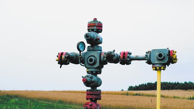 Gas Delivery System Control Station with Pipe Line Junction and Rusty Valves and Pressure Gauge