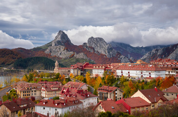 Riano cityscape at sunrise with mountain range landscape during autumn in Picos de Europa National Park, Leon, Spain