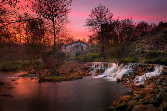 Mondim de Basto waterfall with a mill house at sunset, Norte, Portugal