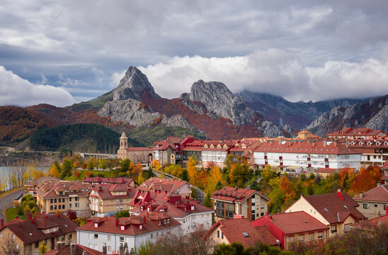 Riano cityscape at sunrise with mountain range landscape during autumn in Picos de Europa National Park, Leon, Spain