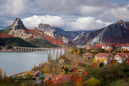 Riano cityscape at sunrise with mountain range landscape during Autumn in Picos de Europa National Park, Leon, Spain