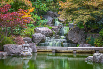 Fototapeta na wymiar Long exposure, waterfall in Kyoto garden in Holland park in London, England 