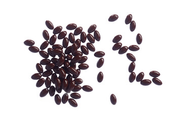 Brown fish oil capsules, vitamins isolated on a white background. Pile of fish oil in gelatin capsules.