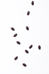 Brown fish oil capsules, vitamins isolated on a white background. Fish oil in gelatin capsules.