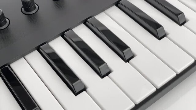 midi keyboard controller rotating closeup
