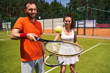 Beginner woman player learning to play tennis