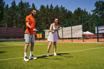 Obraz premium Two young tennis players enjoying their training session