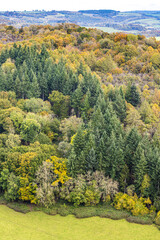 Obraz premium Autumn in the Wye Valley - Mixed woodland on the slopes of Coppett Hill viewed from Symonds Yat Rock, Herefodshire UK