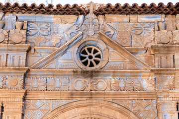 Fototapeta na wymiar Carving with Aztec influences on the church of Iglesia Nuestra Senora de la Regla at Pajara on the Canary Island of Fuerteventura
